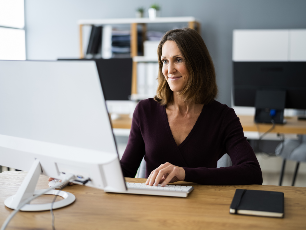 Lady at computer interacting with chat bot